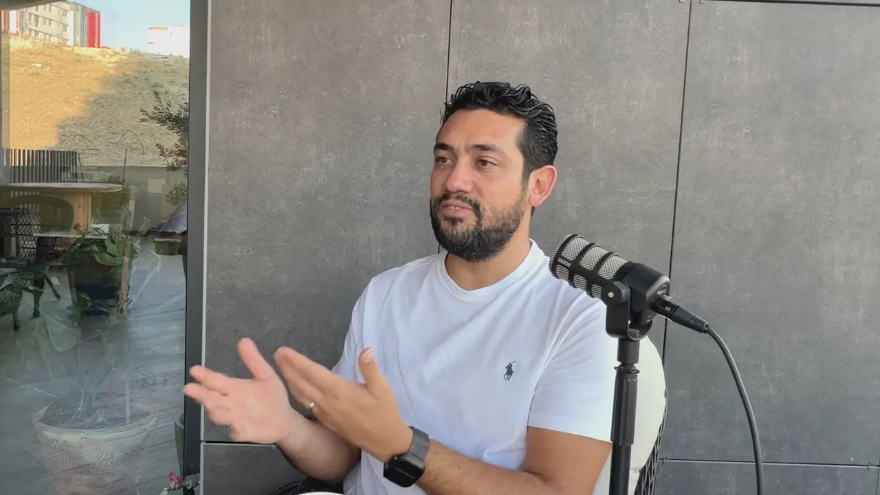 Evren Bayraktar gesturing while saying AI visibility depends on what millions of others say about a brand